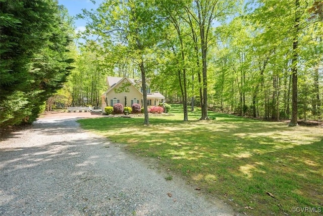 2024 Judes Ferry Rd, Powhatan, VA 23139 - view of front of property with driveway, a front yard, and a forest view