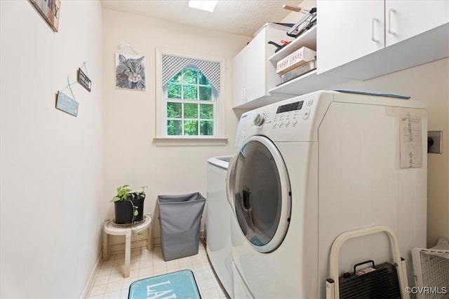 2024 Judes Ferry Rd, Powhatan, VA 23139 - laundry room featuring cabinet space, washer and clothes dryer, baseboards, and light tile patterned floors