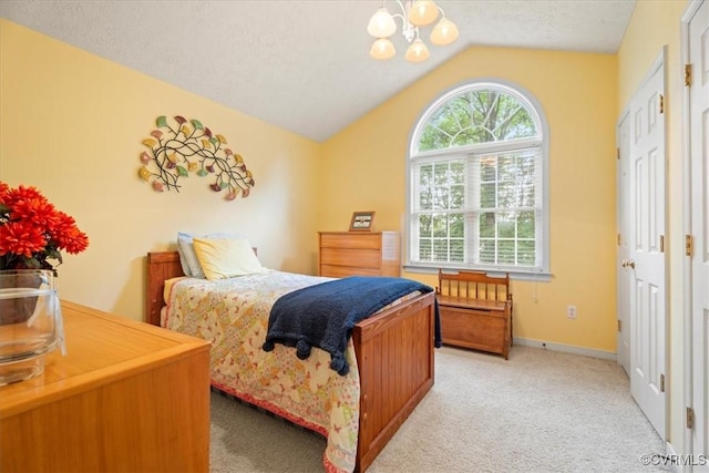 2024 Judes Ferry Rd, Powhatan, VA 23139 - carpeted bedroom featuring lofted ceiling, a chandelier, and baseboards