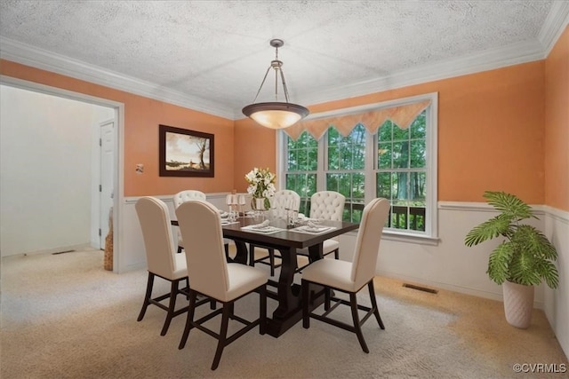 2024 Judes Ferry Rd, Powhatan, VA 23139 - dining space with carpet, ornamental molding, a textured ceiling, and wainscoting