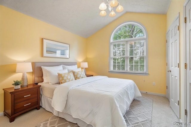 2024 Judes Ferry Rd, Powhatan, VA 23139 - bedroom featuring vaulted ceiling, light colored carpet, a chandelier, and a textured ceiling
