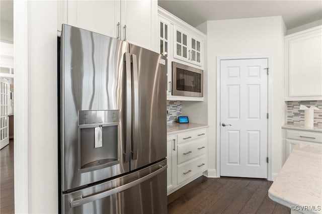 4025 Carrie Mill Xing, Glen Allen, VA 23059 - kitchen featuring stainless steel appliances, dark wood-type flooring, decorative backsplash, white cabinetry, and glass insert cabinets