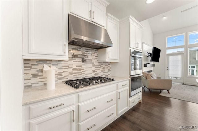 4025 Carrie Mill Xing, Glen Allen, VA 23059 - kitchen with under cabinet range hood, appliances with stainless steel finishes, white cabinets, dark wood-type flooring, and backsplash