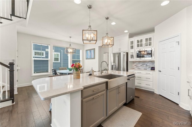 4025 Carrie Mill Xing, Glen Allen, VA 23059 - kitchen with appliances with stainless steel finishes, a chandelier, recessed lighting, dark wood-type flooring, and a kitchen island with sink