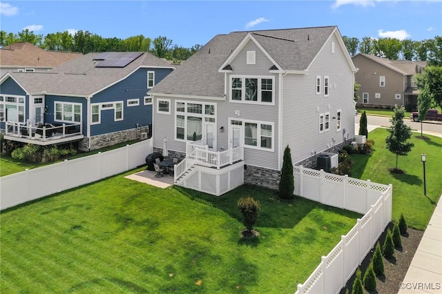 4025 Carrie Mill Xing, Glen Allen, VA 23059 - back of property featuring a fenced backyard, a wooden deck, a residential view, and a shingled roof