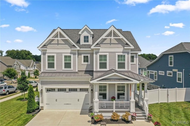 4025 Carrie Mill Xing, Glen Allen, VA 23059 - view of front of home featuring a standing seam roof, covered porch, a metal roof, a garage, and concrete driveway