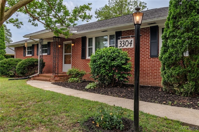 3304 Walnut St, Hopewell, VA 23860 - ranch-style house with brick siding and a front lawn