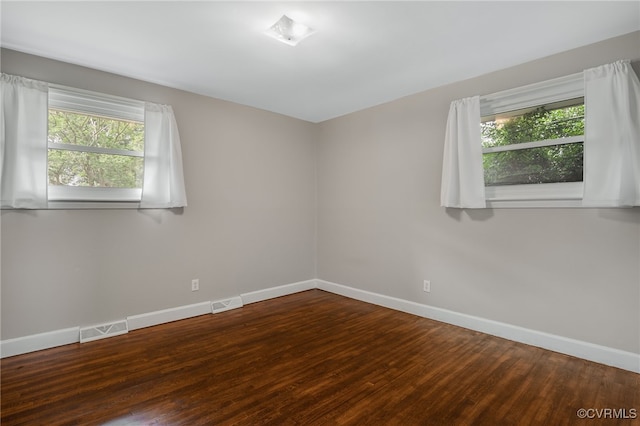 3304 Walnut St, Hopewell, VA 23860 - spare room featuring healthy amount of natural light and wood finished floors