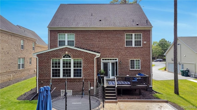 5217 Aldenbrook Way, Henrico, VA 23059 - back of property with brick siding, a wooden deck, and a lawn