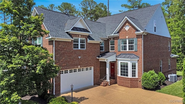 5217 Aldenbrook Way, Henrico, VA 23059 - view of front facade featuring concrete driveway, brick siding, cooling unit, an attached garage, and roof with shingles