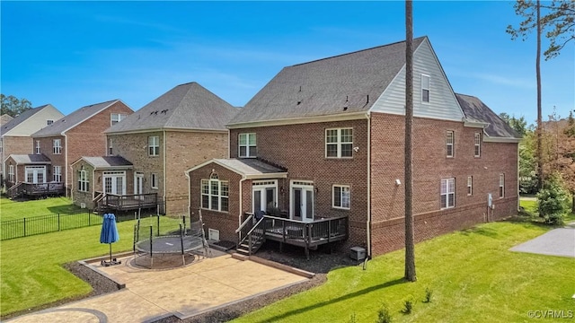 5217 Aldenbrook Way, Henrico, VA 23059 - back of property with a patio, a wooden deck, brick siding, and a trampoline