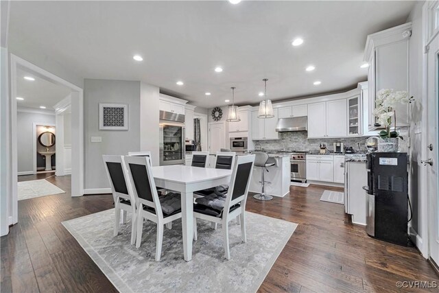 5217 Aldenbrook Way, Henrico, VA 23059 - dining area with recessed lighting, dark wood-style flooring, baseboards, and crown molding