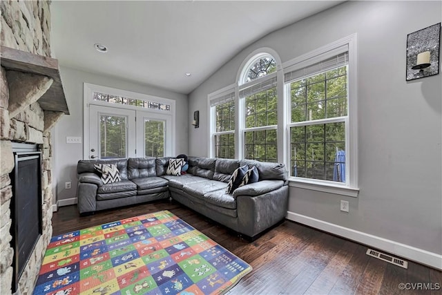 5217 Aldenbrook Way, Henrico, VA 23059 - living room with a stone fireplace, lofted ceiling, dark wood finished floors, and baseboards