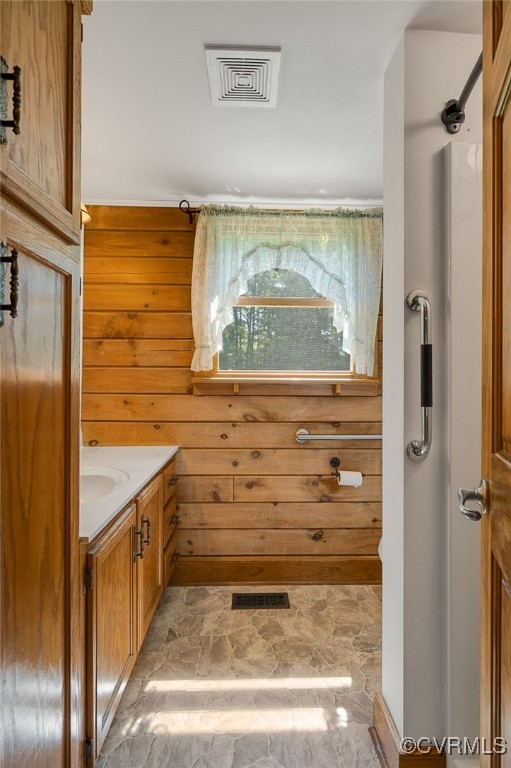 4285 Hadensville Farm Rd, Goochland, VA 23117 - bathroom featuring vanity, wood walls, and stone finish flooring