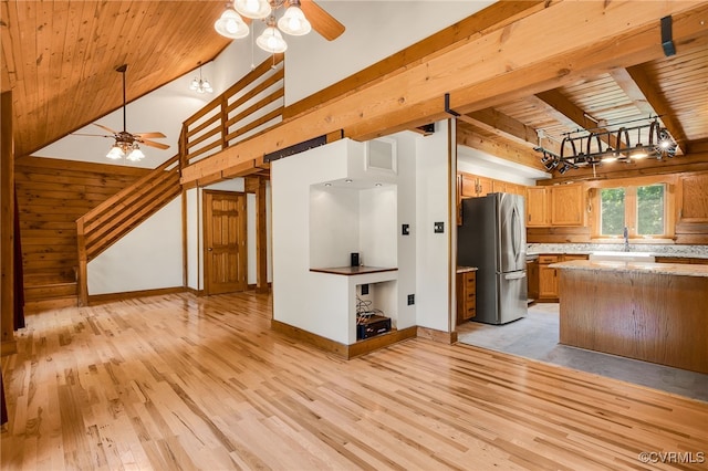 4285 Hadensville Farm Rd, Goochland, VA 23117 - kitchen with freestanding refrigerator, ceiling fan, a wooden ceiling with exposed beams, light wood-style floors, and brown cabinetry