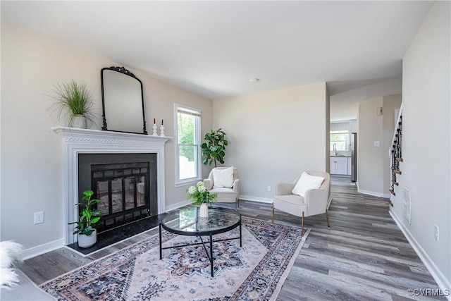 5007 Gention Rd, Chesterfield, VA 23832 - living area with wood finished floors, a glass covered fireplace, and baseboards