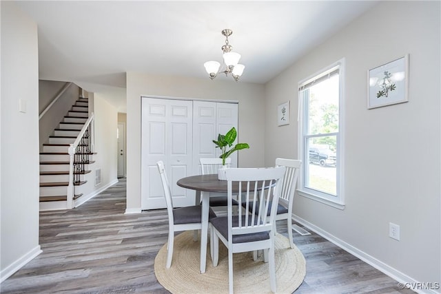 5007 Gention Rd, Chesterfield, VA 23832 - dining space with stairway, a chandelier, wood finished floors, and baseboards