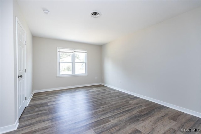 5007 Gention Rd, Chesterfield, VA 23832 - spare room featuring dark wood-type flooring, baseboards, and a smoke detector