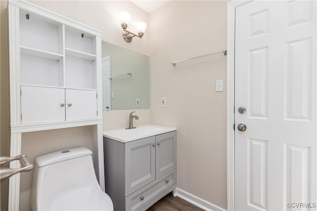 5007 Gention Rd, Chesterfield, VA 23832 - bathroom featuring vanity, toilet, baseboards, and wood finished floors