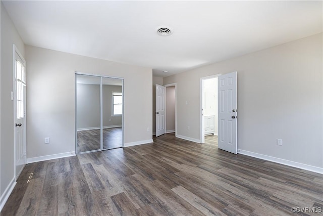 5007 Gention Rd, Chesterfield, VA 23832 - unfurnished bedroom featuring dark wood finished floors, a closet, and baseboards