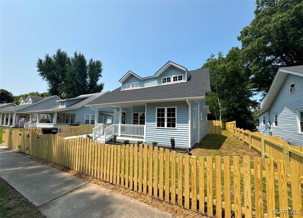 320 Brown Ave, Hopewell, VA 23860 - view of front of property featuring covered porch, a fenced front yard, and roof with shingles