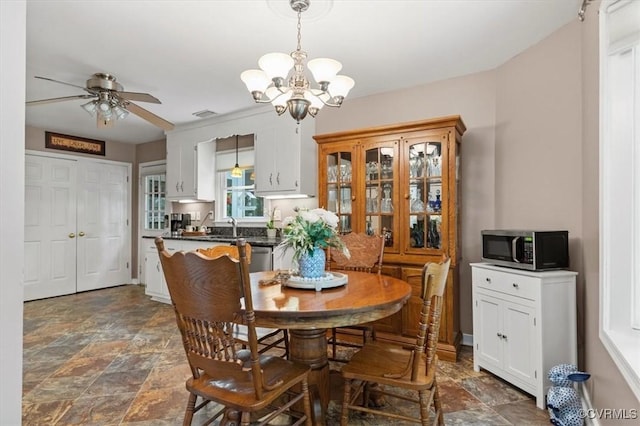 7503 Native Dancer Dr, Midlothian, VA 23112 - dining space featuring stone finish flooring, a chandelier, and ceiling fan