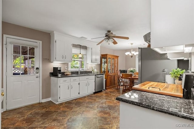 7503 Native Dancer Dr, Midlothian, VA 23112 - kitchen with stainless steel appliances, a ceiling fan, stone finish floors, baseboards, and white cabinets