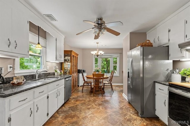 7503 Native Dancer Dr, Midlothian, VA 23112 - kitchen with a sink, appliances with stainless steel finishes, ceiling fan, a chandelier, and white cabinetry