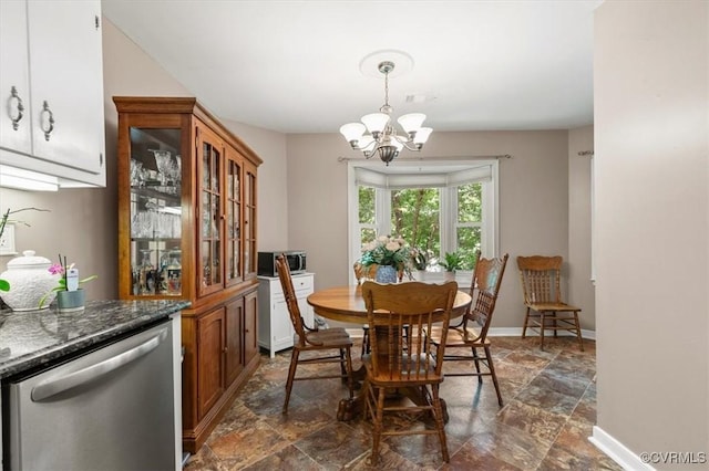 7503 Native Dancer Dr, Midlothian, VA 23112 - dining space featuring dark stone finish floors, a chandelier, and baseboards