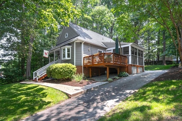 7503 Native Dancer Dr, Midlothian, VA 23112 - view of front of house with a sunroom, stairs, a deck, asphalt driveway, and a front yard