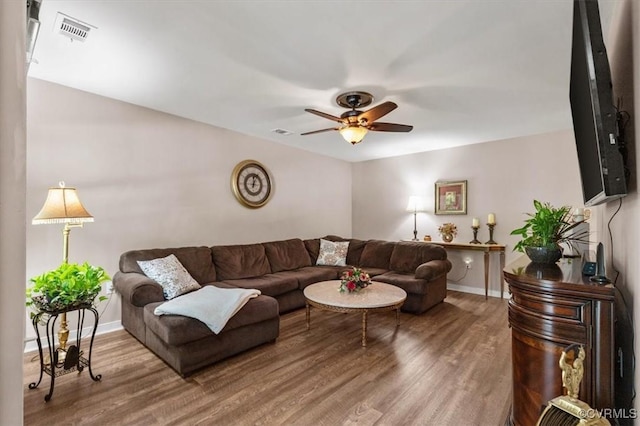 7503 Native Dancer Dr, Midlothian, VA 23112 - living area with wood finished floors, a ceiling fan, and baseboards