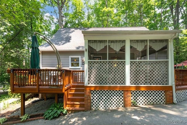 7503 Native Dancer Dr, Midlothian, VA 23112 - rear view of house with a sunroom, a shingled roof, a wooden deck, and stairway