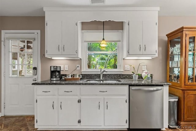 7503 Native Dancer Dr, Midlothian, VA 23112 - kitchen with stainless steel dishwasher, white cabinetry, a sink, and dark stone countertops