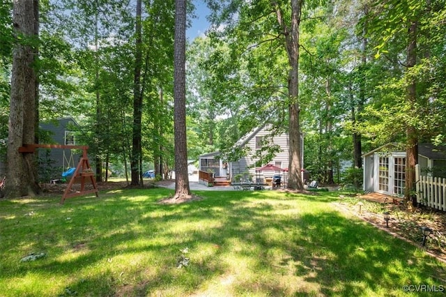 7503 Native Dancer Dr, Midlothian, VA 23112 - view of green lawn featuring a playground, an outdoor structure, and french doors