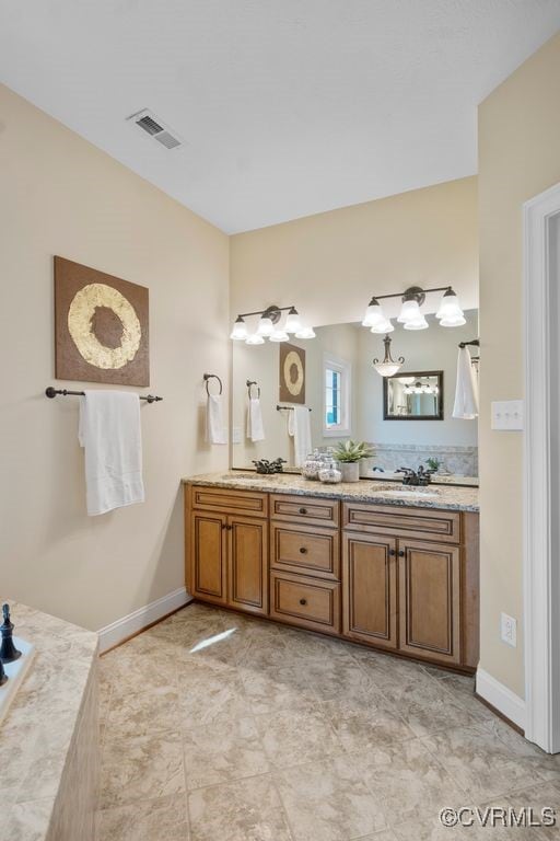 12316 Traylor Field Ln, Ashland, VA 23005 - full bathroom with double vanity, baseboards, and a bathtub