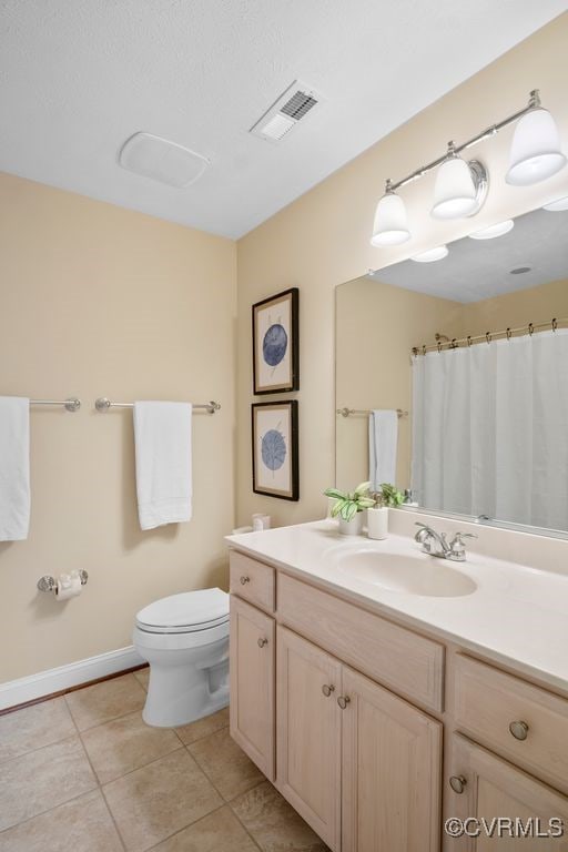 12316 Traylor Field Ln, Ashland, VA 23005 - full bath with vanity, toilet, tile patterned flooring, baseboards, and a shower with curtain
