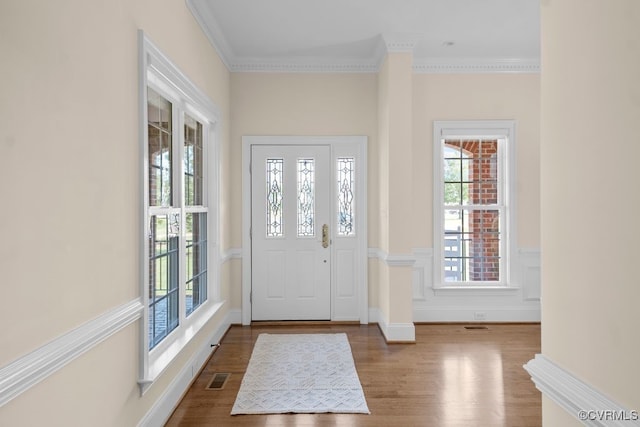 12316 Traylor Field Ln, Ashland, VA 23005 - foyer entrance with wood finished floors, ornamental molding, and wainscoting