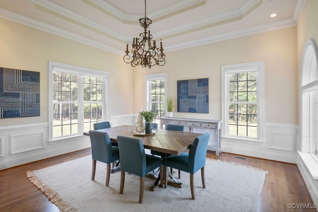 12316 Traylor Field Ln, Ashland, VA 23005 - dining space featuring wood finished floors, ornamental molding, wainscoting, a raised ceiling, and a chandelier