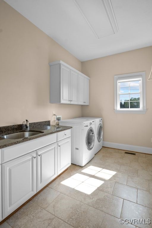 12316 Traylor Field Ln, Ashland, VA 23005 - laundry area with cabinet space, washing machine and dryer, attic access, baseboards, and light stone finish floors