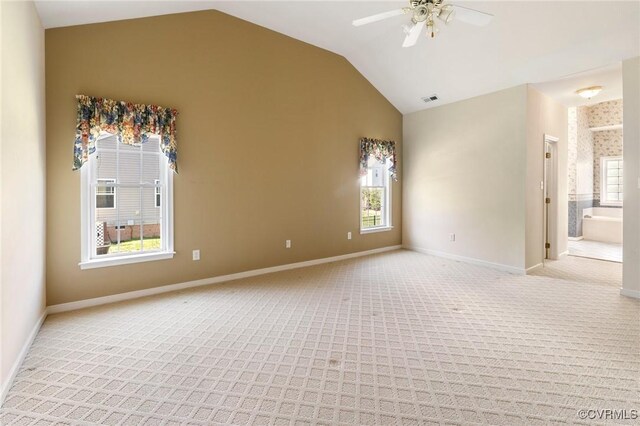 9401 Nolandwood Dr, Mechanicsville, VA 23116 - spare room featuring light colored carpet, lofted ceiling, ceiling fan, and baseboards