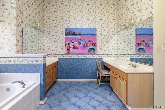 9401 Nolandwood Dr, Mechanicsville, VA 23116 - full bathroom with wallpapered walls, two vanities, a bath, baseboards, and tile patterned flooring