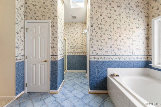9401 Nolandwood Dr, Mechanicsville, VA 23116 - bathroom featuring wallpapered walls, a garden tub, and tile patterned floors