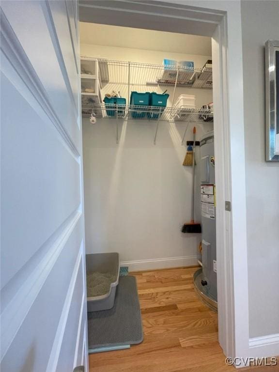 1710 N 29th St, Richmond, VA 23223 - walk in closet featuring wood finished floors and electric water heater