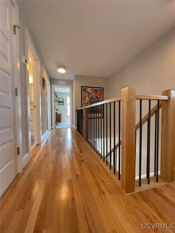 1710 N 29th St, Richmond, VA 23223 - hall with wood finished floors and baseboards