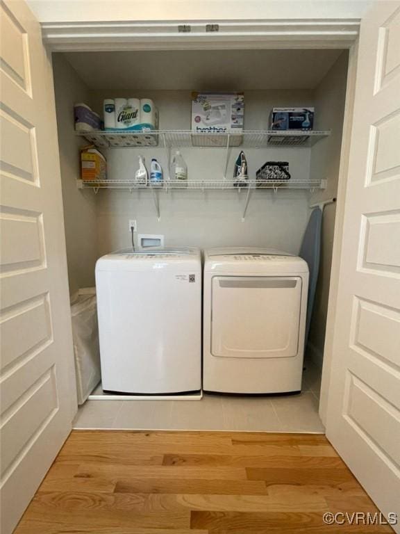 1710 N 29th St, Richmond, VA 23223 - laundry room with washer and dryer and light wood-style floors