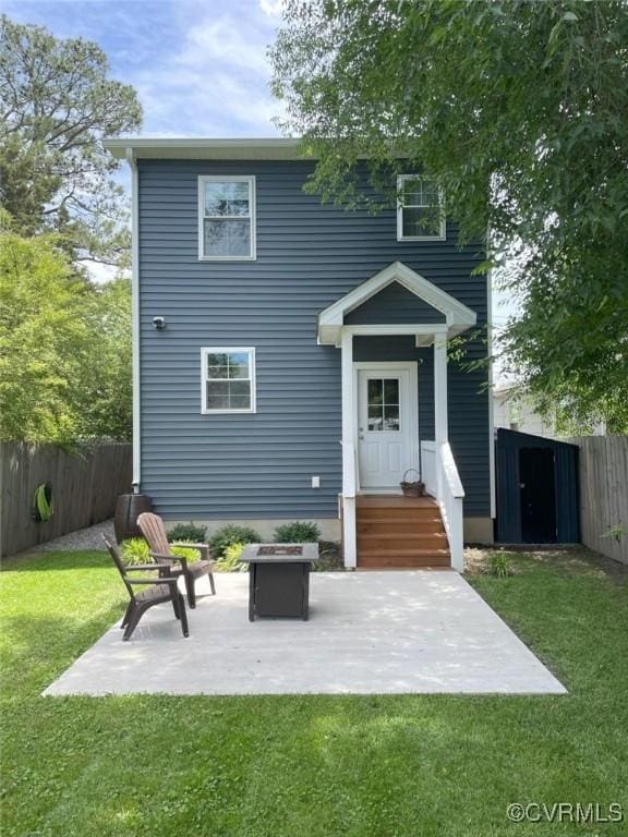 1710 N 29th St, Richmond, VA 23223 - rear view of house featuring a patio area and an outdoor fire pit