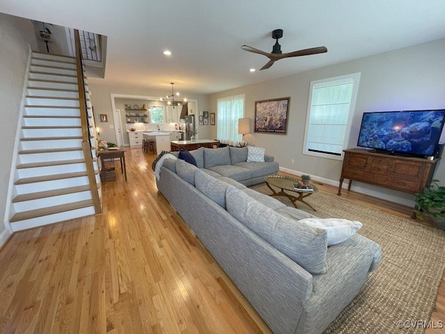 1710 N 29th St, Richmond, VA 23223 - living area featuring light wood-style flooring, ceiling fan, stairway, baseboards, and recessed lighting