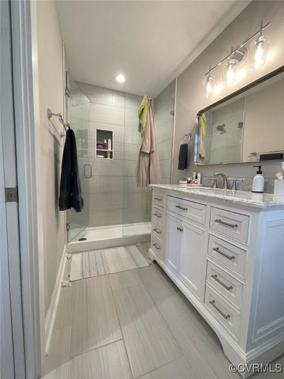 1710 N 29th St, Richmond, VA 23223 - bathroom featuring a shower stall, vanity, recessed lighting, and baseboards