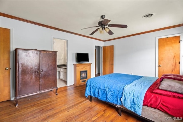 2911 Ennismore Ct, Chesterfield, VA 23224 - bedroom with wood finished floors, crown molding, ensuite bathroom, and a ceiling fan