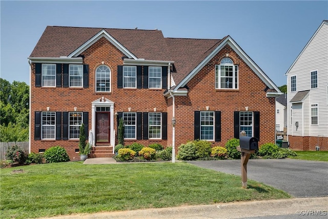 1408 Selma Ln, Henrico, VA 23223 - colonial-style house with brick siding and a front lawn